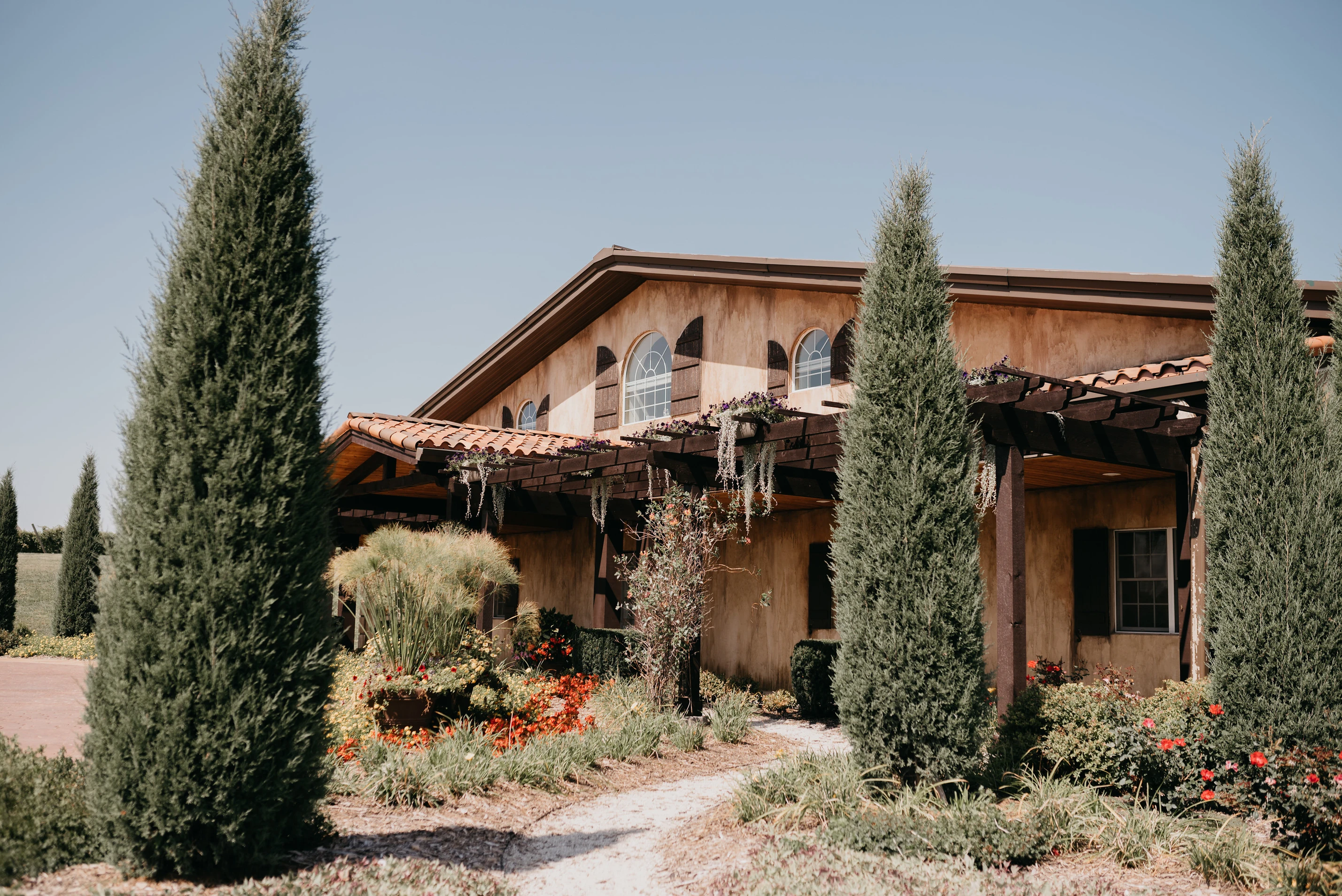 The Vineyard Vitality Escape venue framed by trees and gardens.