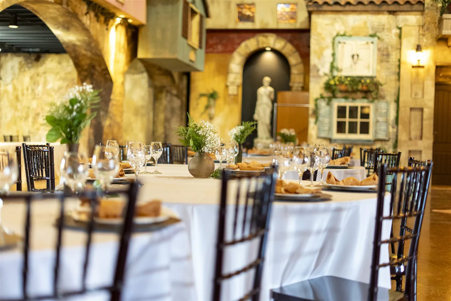 Thoughtful table settings and greenery, ready for guests.