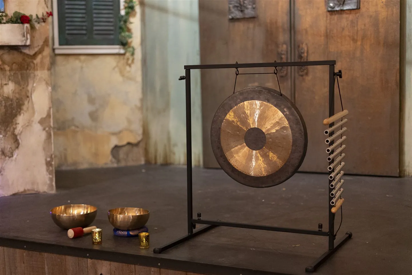 Singing bowls and a gong, prepared for sound healing.